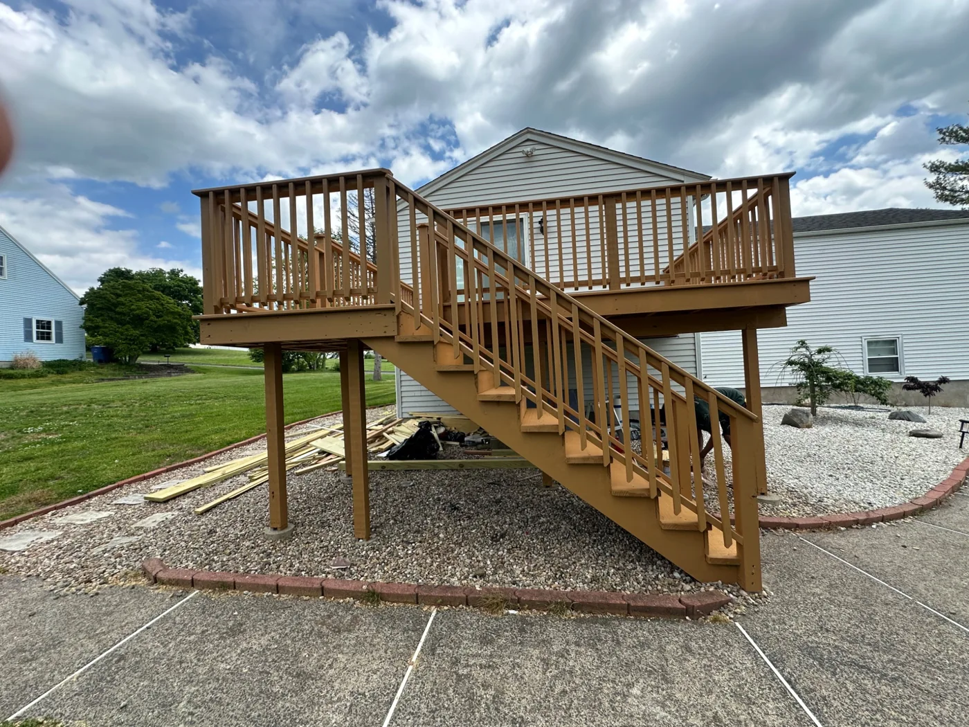 Raised wooden deck with stairs and railings