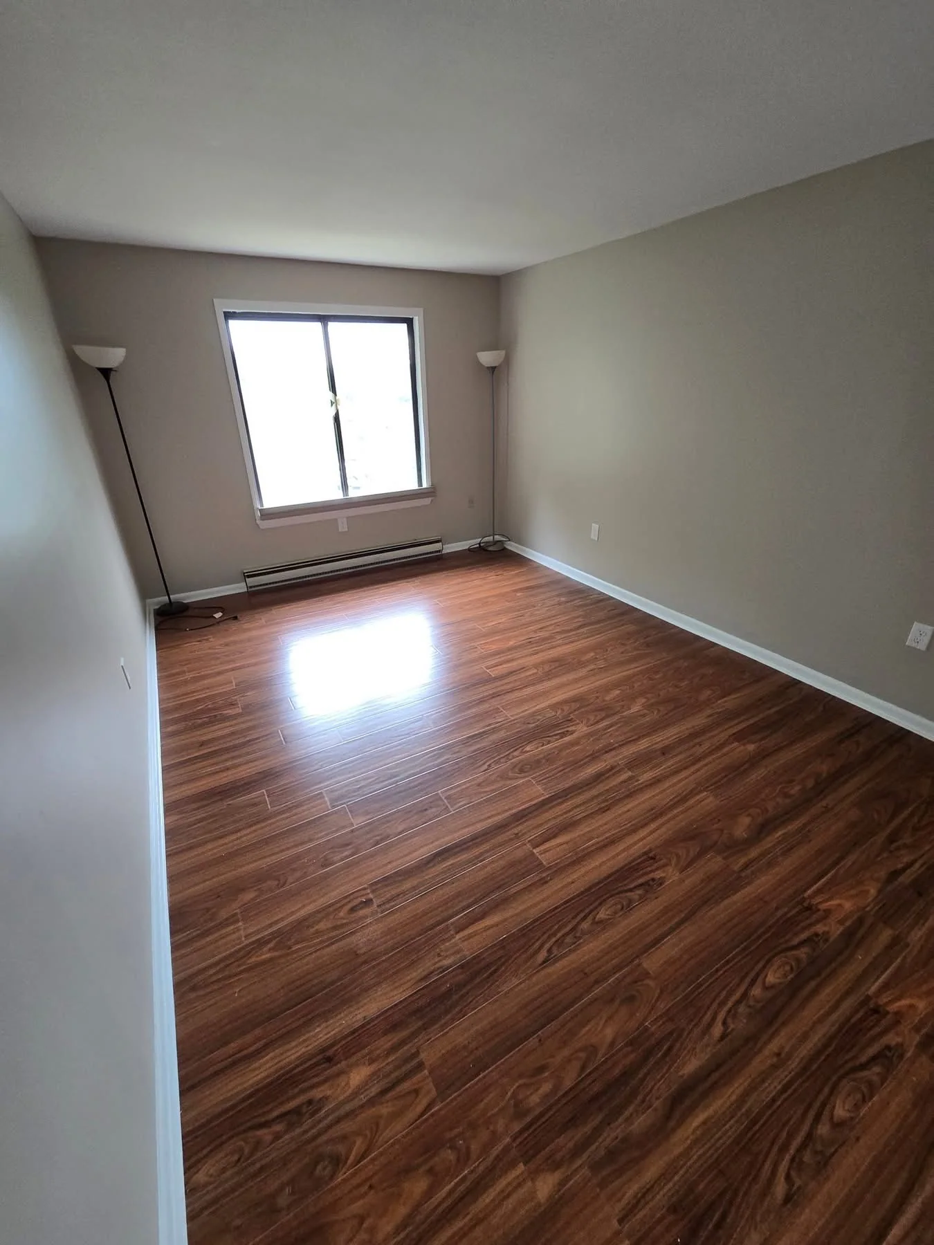 Completed LVP flooring in bright room with natural light
